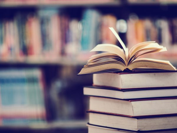 Book in library with open textbook,education learning concept Book in library with open textbook,education learning concept
